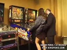 Beautiful girl makes love by the pinball